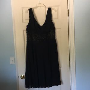Black cocktail dress with deep v front and back